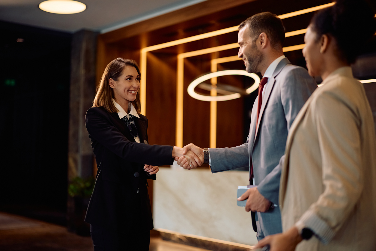 A man and woman shaking hands.